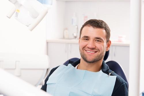 Dental patient smiling at preventive dental exam in Beachwood, OH