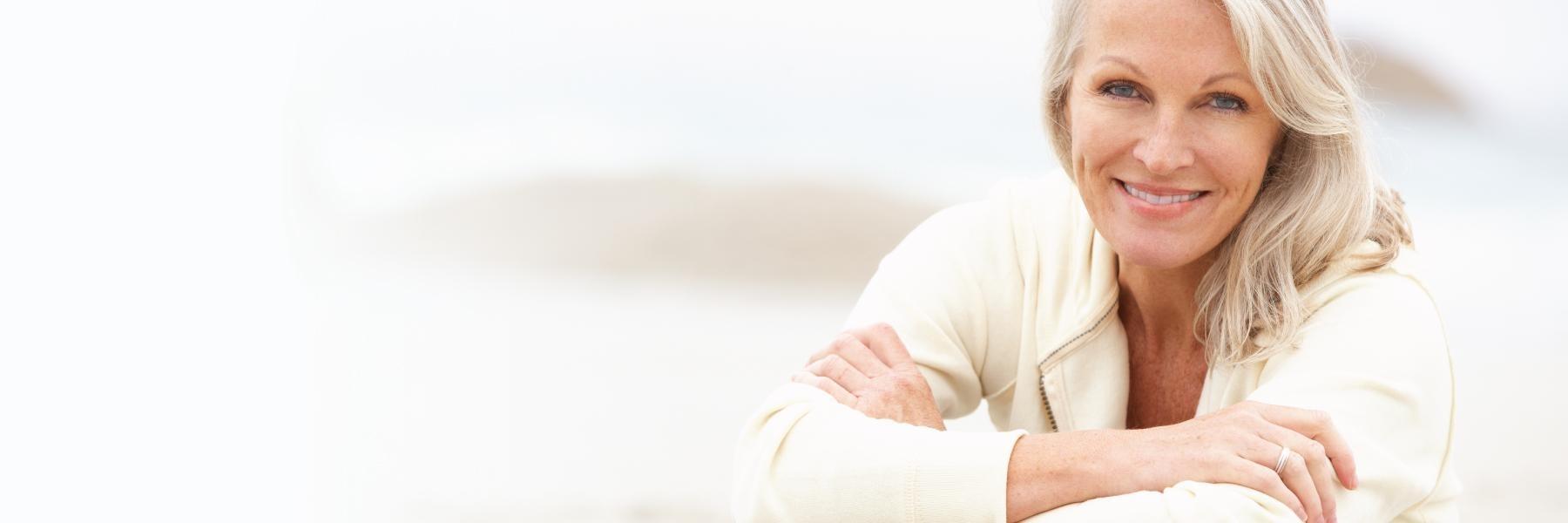 Woman smiling after getting dental implants in Beachwood, Ohio