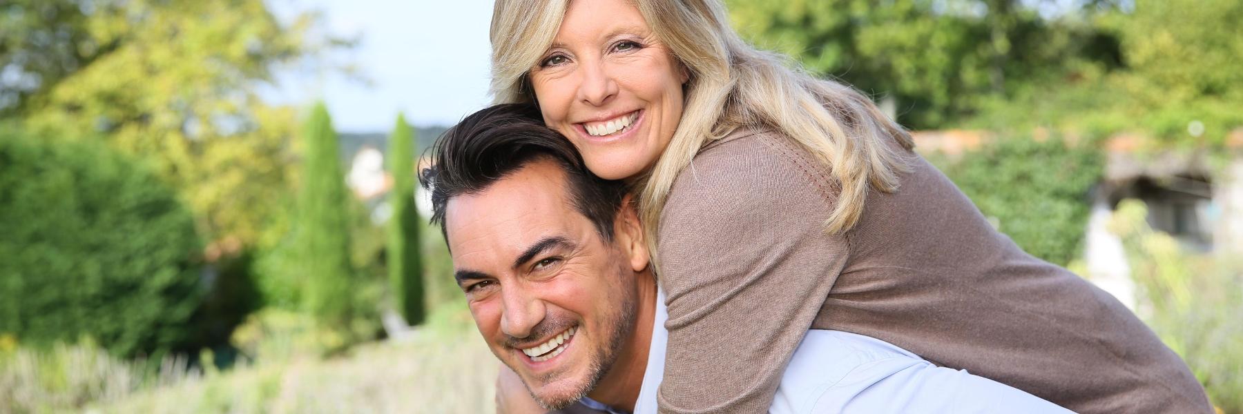 Couple smiling after sleep apnea treatment in Beachwood, OH