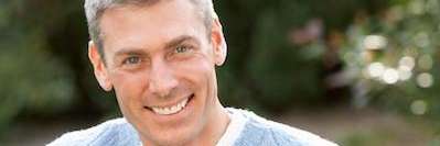 A man smiling after getting dental implants In Beachwood, OH