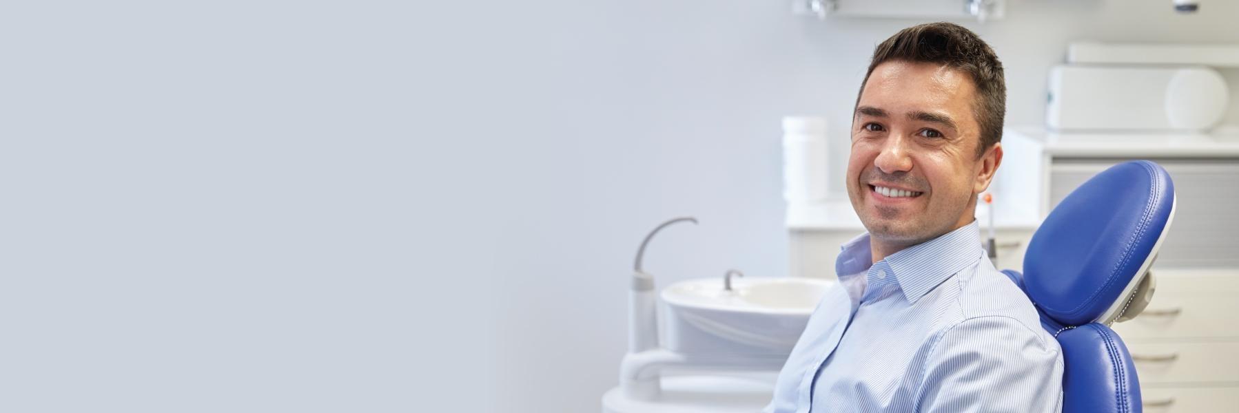 Man smiling in treatment during a dental visit in Beachwood, OH