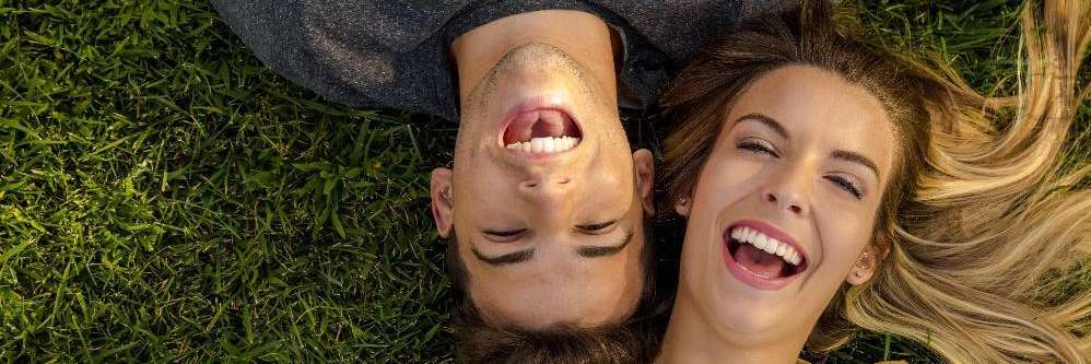 Couple smiling after getting veneers in Beachwood, OH