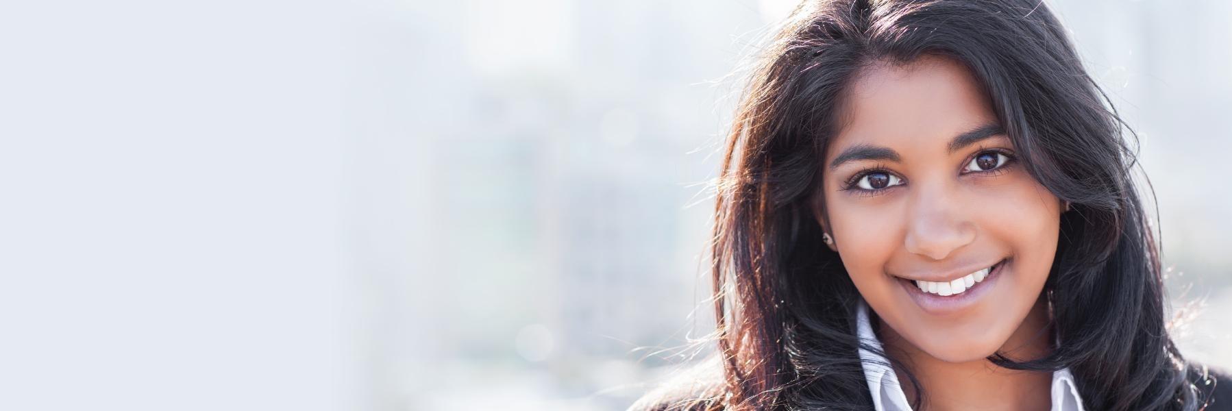 Dental patient smiling with dental bridges in Beachwood, OH